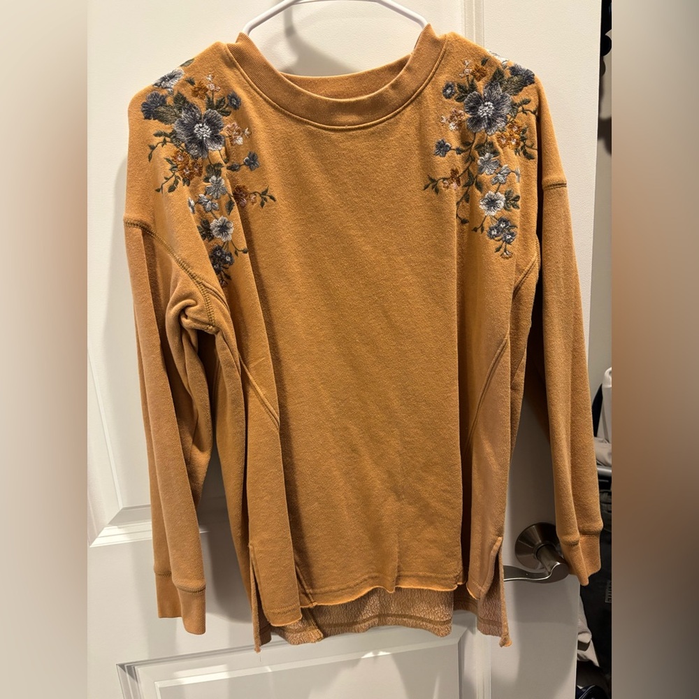 American eagle tan sweater with floral stitching on sleeve